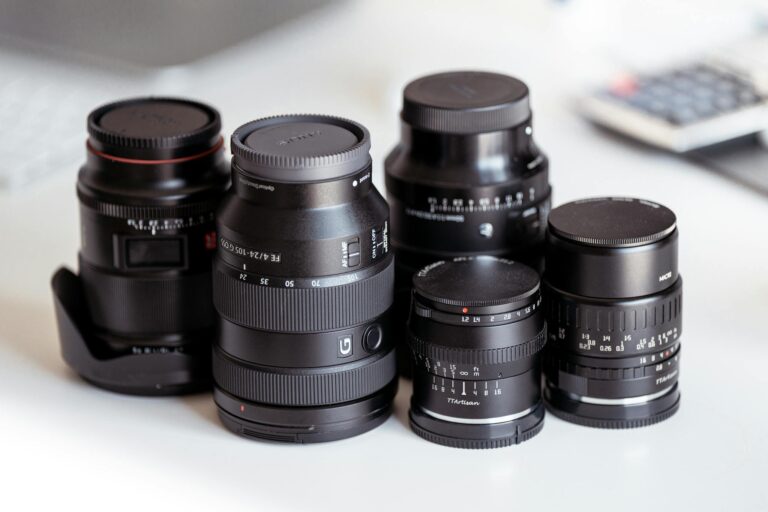 Collection of different camera lenses on a desk for photography enthusiasts.